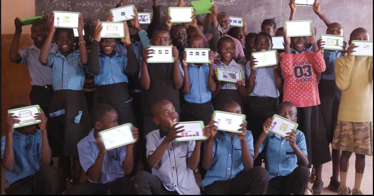 Students holding books at school